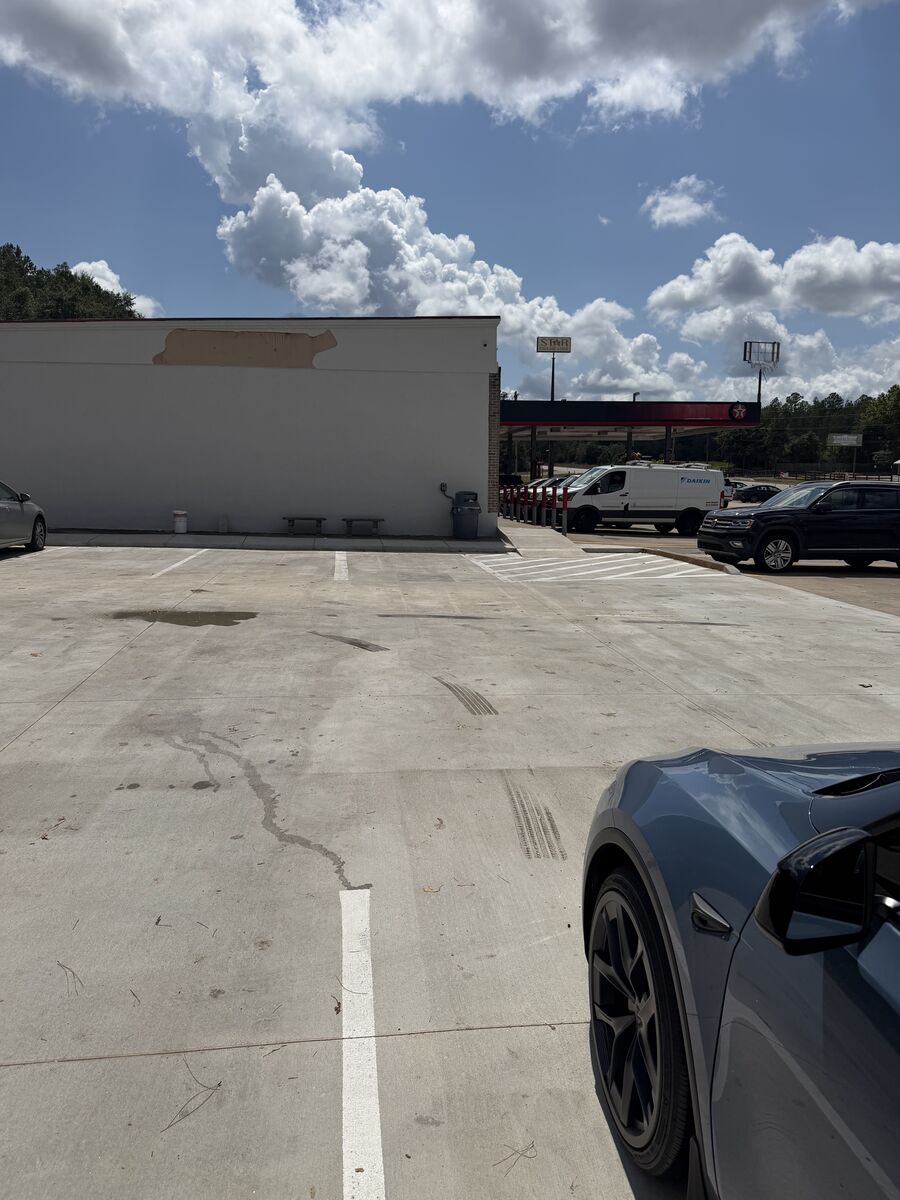 The Texaco convenience store and fuel canopy in Prattville, Alabama, seen across the freshly poured charging pad